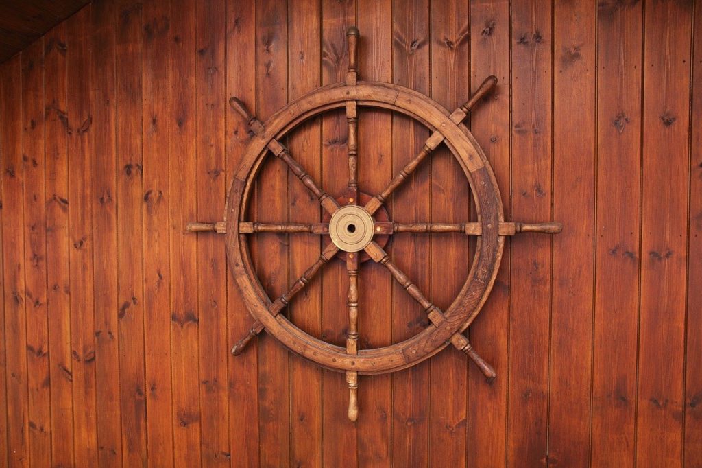 Ship steering wheel on wall