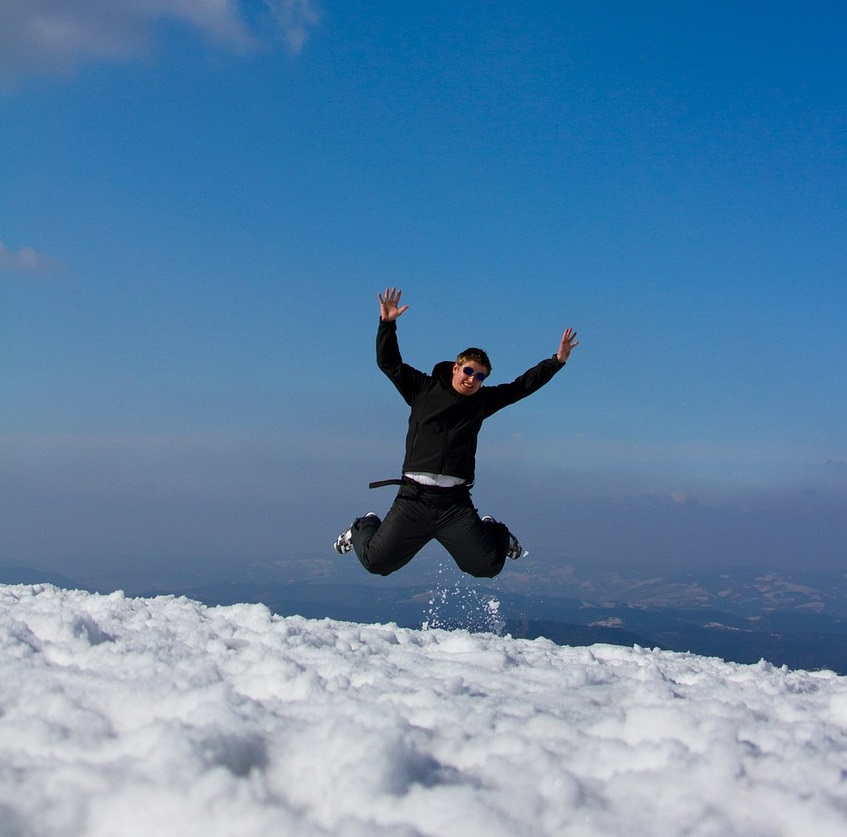 man jumping in snow